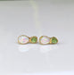 Dainty raw Peridot and Opal stud earrings handcrafted with an elegant rustic design, perfect for everyday wear or special occasions.