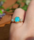 Raw Peruvian Opal and diamond ring in solid 14k gold, featuring a unique blue opal centerpiece.