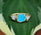 Raw Peruvian Opal and diamond ring in solid 14k gold, featuring a vibrant blue opal with two conflict-free diamonds.