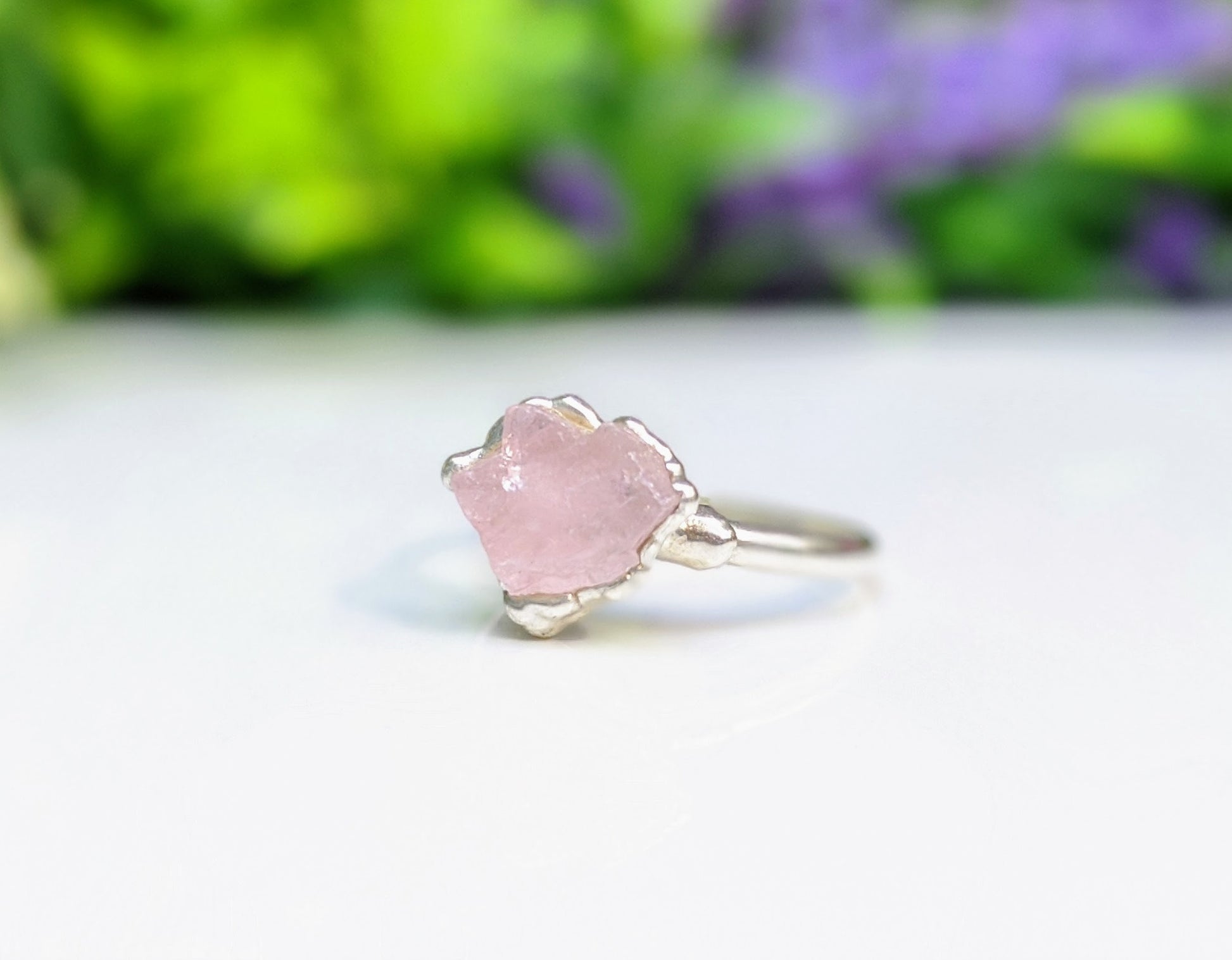 Raw pink Morganite ring set on a Sterling Silver band, showcasing a unique handcrafted design.