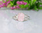Raw Morganite ring on a sterling silver band showcasing a rough pink Morganite and two natural diamonds.