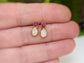 Handcrafted raw Ruby and Opal stud earrings in gold setting, showcasing a unique design for elegant everyday wear.