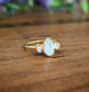 Raw rainbow Moonstone and Herkimer diamond engagement ring set in 14k gold with 18k gold plating.