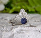 Raw sapphire and diamond wedding ring set featuring a sterling silver band, unique and captivating design.