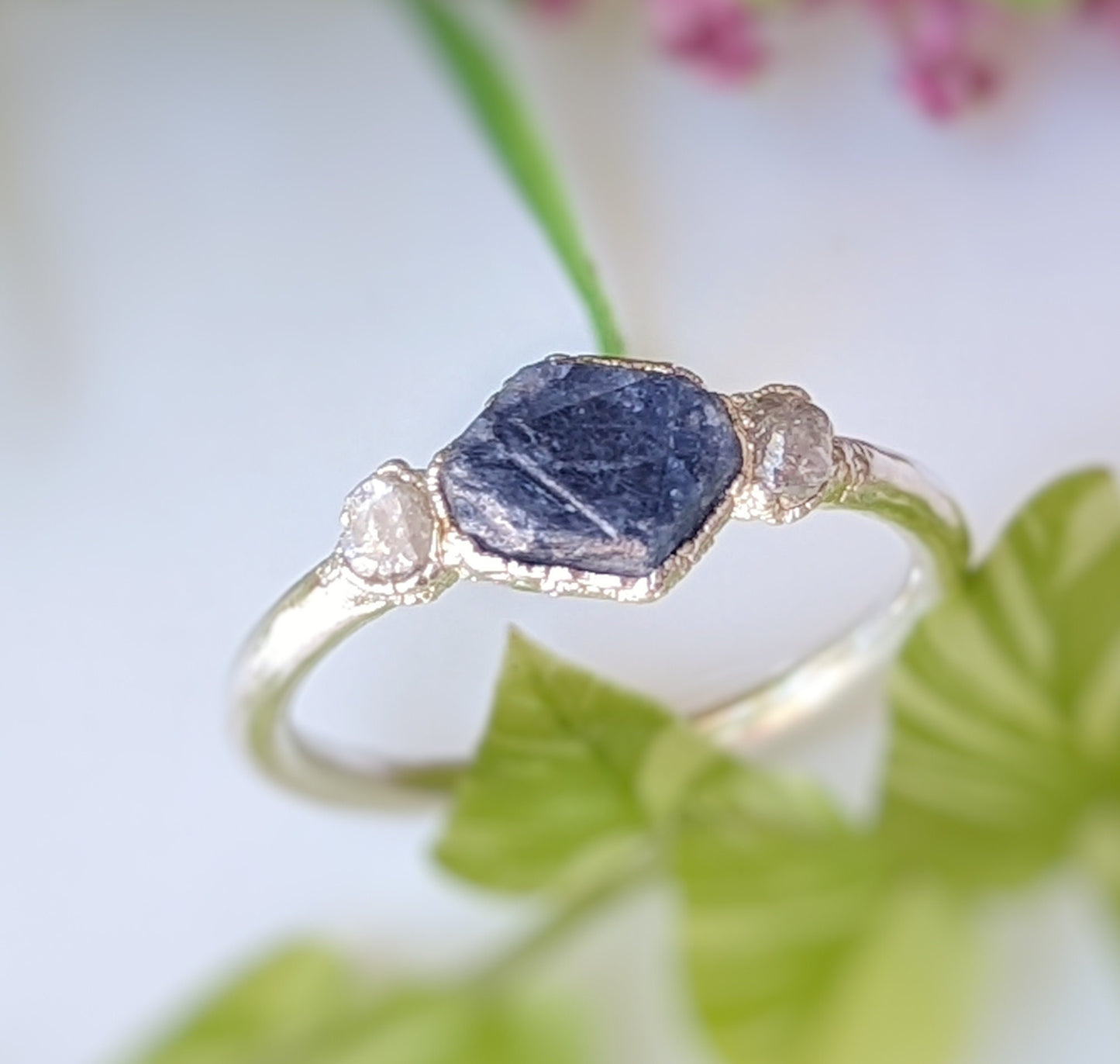 Raw sapphire and rough diamond ring, showcasing rustic beauty and unique design, ideal for love celebrations or September birthstone gifts.