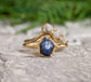Raw Sapphire and diamond chevron ring set in 14k gold, perfect for nature-loving couples.