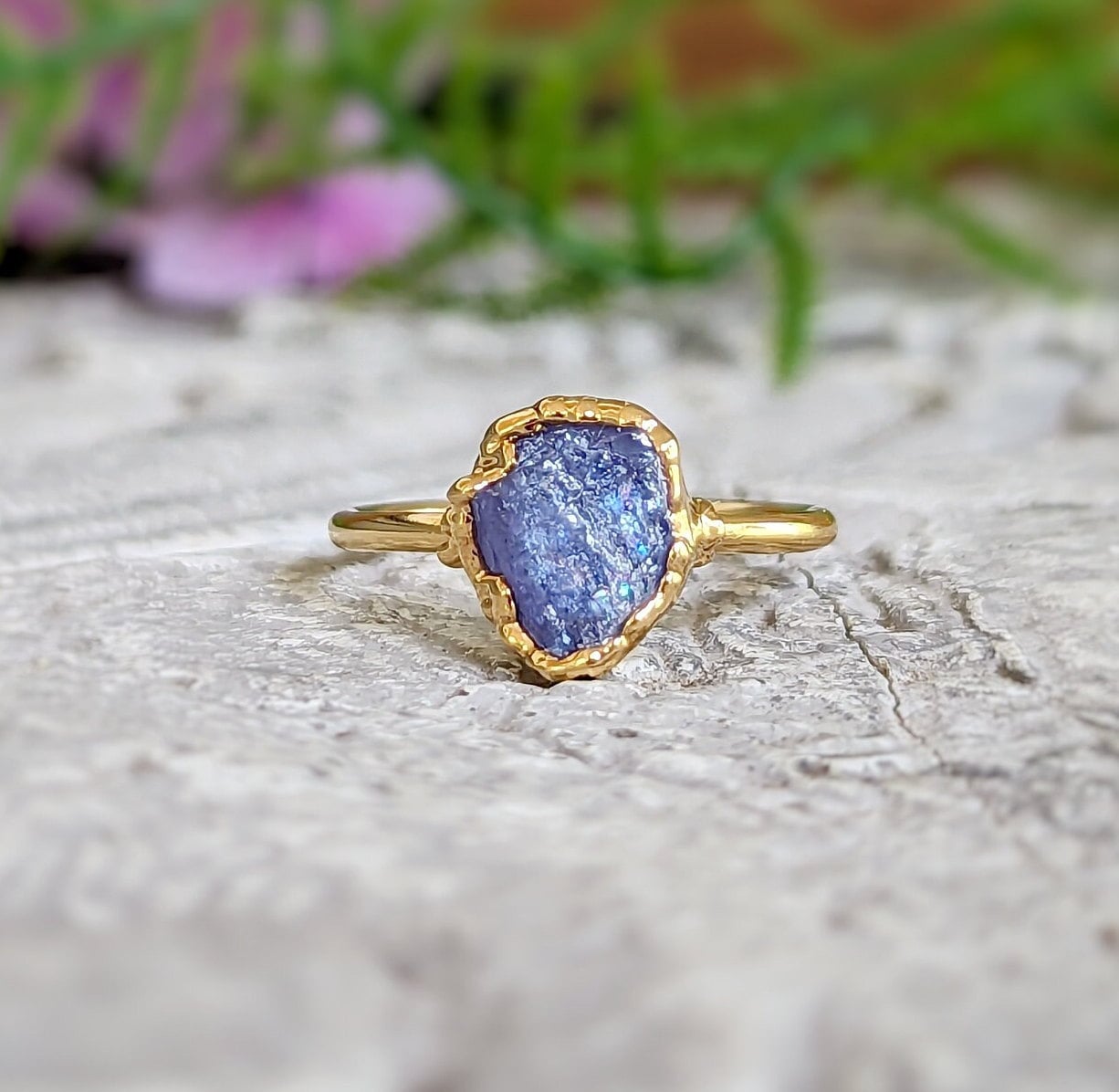 Raw Tanzanite crystal ring set in handcrafted 14k gold, showcasing a unique and stunning design.