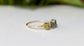 Elegant Raw Tourmaline eternity ring featuring colorful gemstones set on a gold-filled band.