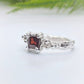 Unique Red Garnet engagement ring in solid sterling silver with an organic textured band.