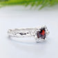 Red Garnet engagement ring in solid sterling silver with an organic textured band and square cut gemstone.
