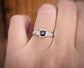 Elegant red garnet engagement ring in solid 14k gold, featuring a square cut stone and delicate accents.