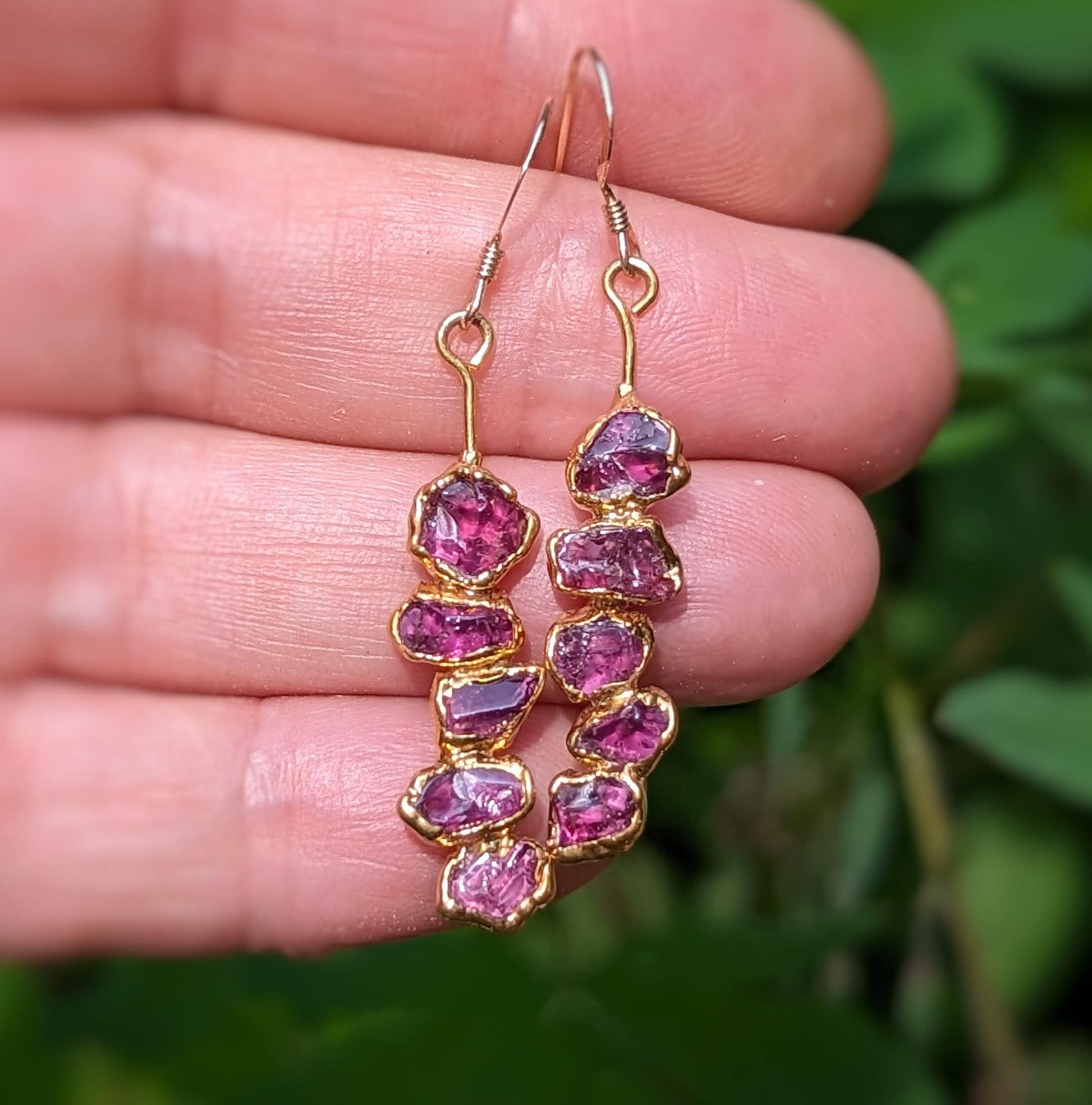 Rhodolite Garnet dangle earrings featuring raw raspberry pink gems, perfect for special occasions or as a unique gift.