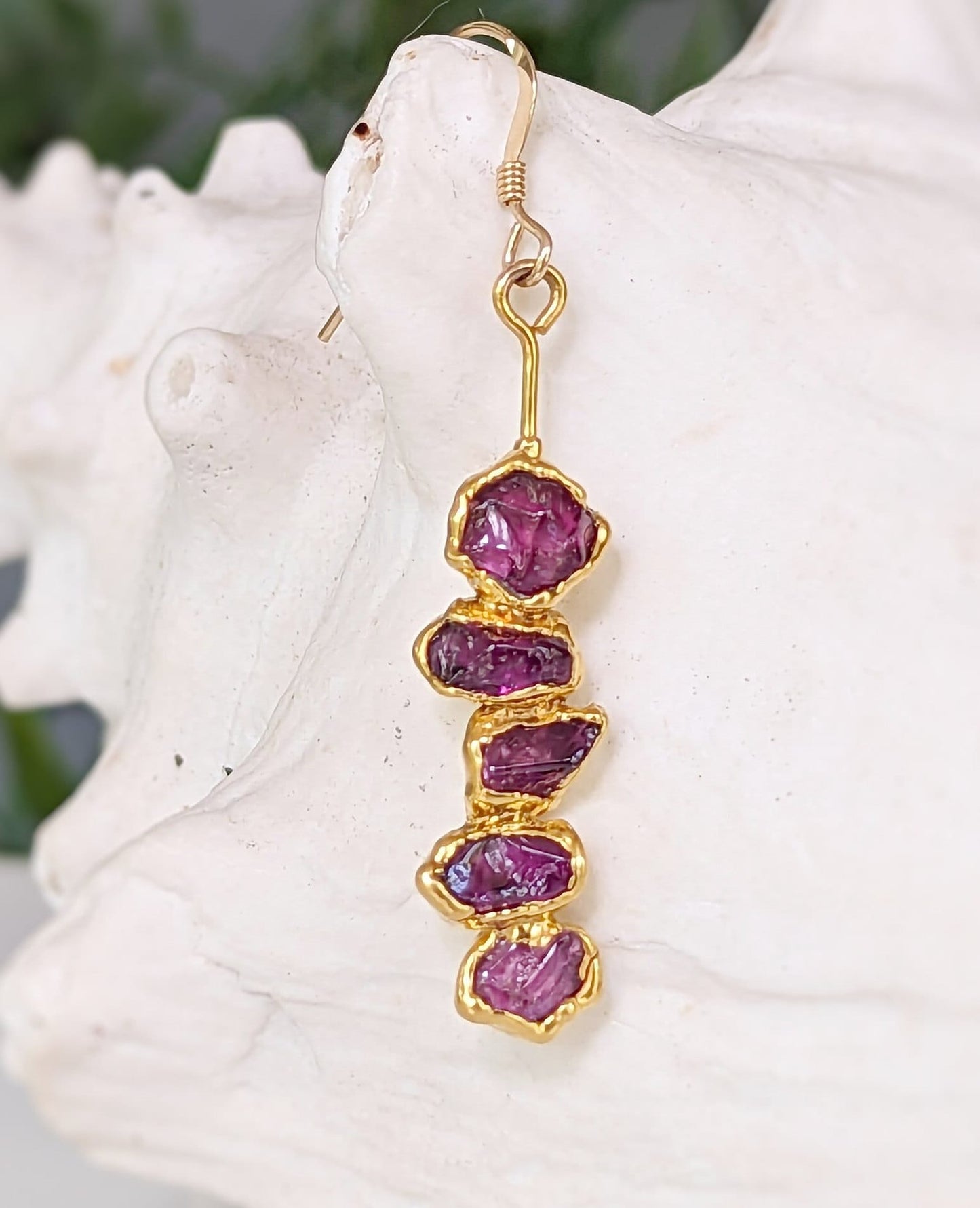 Rhodolite Garnet dangle earrings with raw raspberry pink stones in unique gold setting.