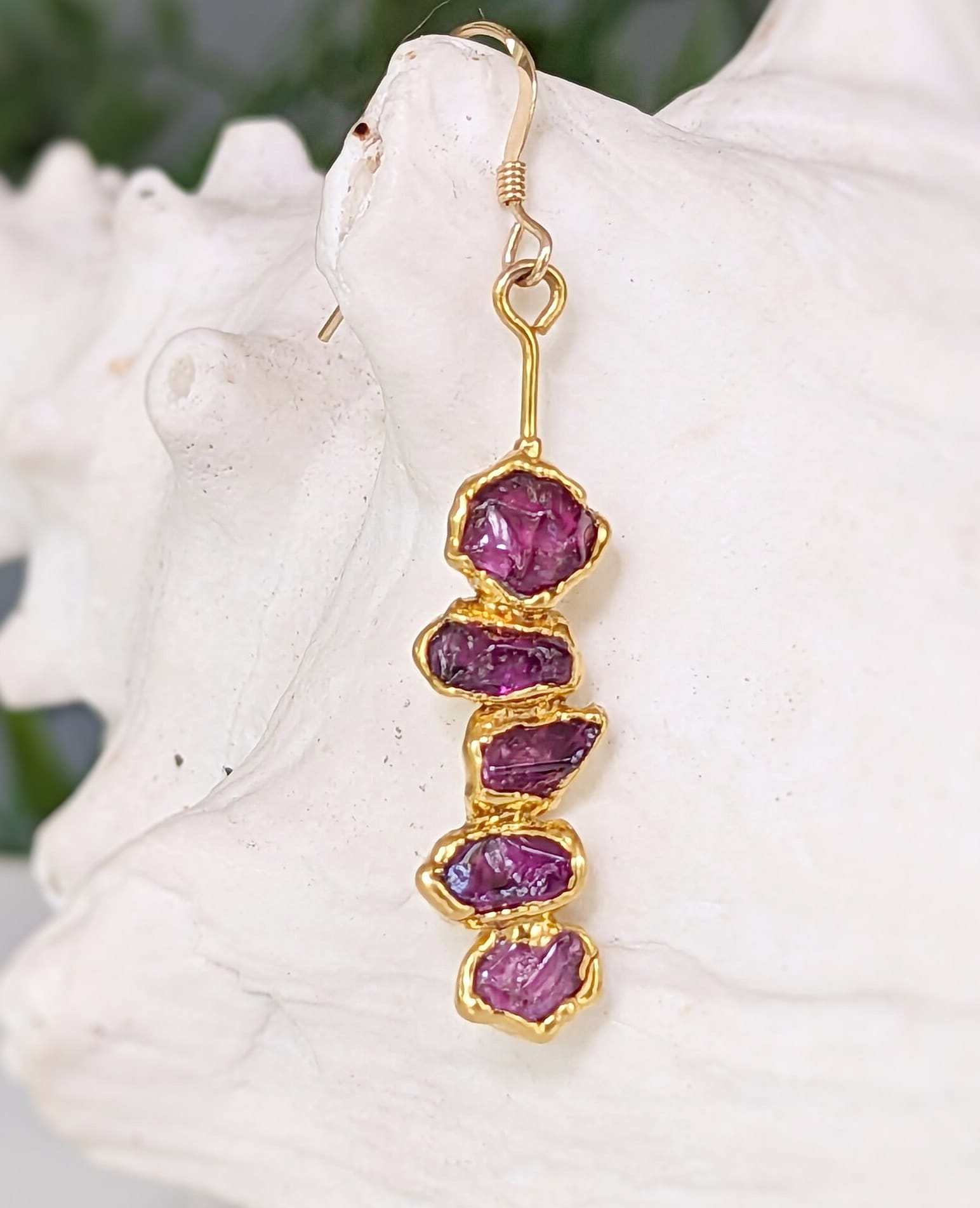 Rhodolite Garnet dangle earrings with raw raspberry pink stones in unique gold setting.