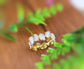 Rose Quartz eternity gold ring featuring unique shapes and gemstones, set on a 14k gold filled band.