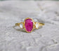 Rubellite Tourmaline and diamond engagement ring on 14k gold band, showcasing pink gemstone and Herkimer diamonds.
