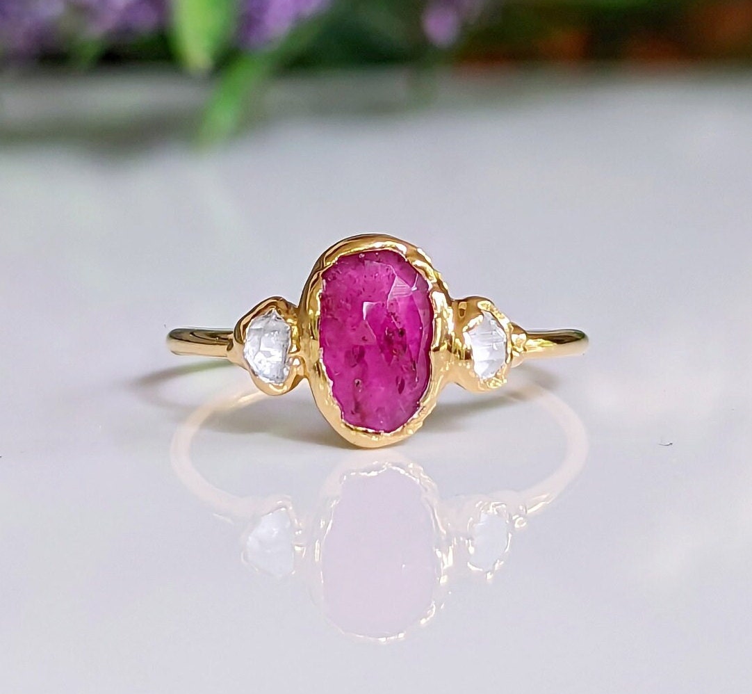 Rubellite Tourmaline engagement ring with Herkimer diamonds on a 14k gold band.