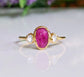 Rubellite Tourmaline engagement ring with Herkimer diamonds on a 14k gold band.
