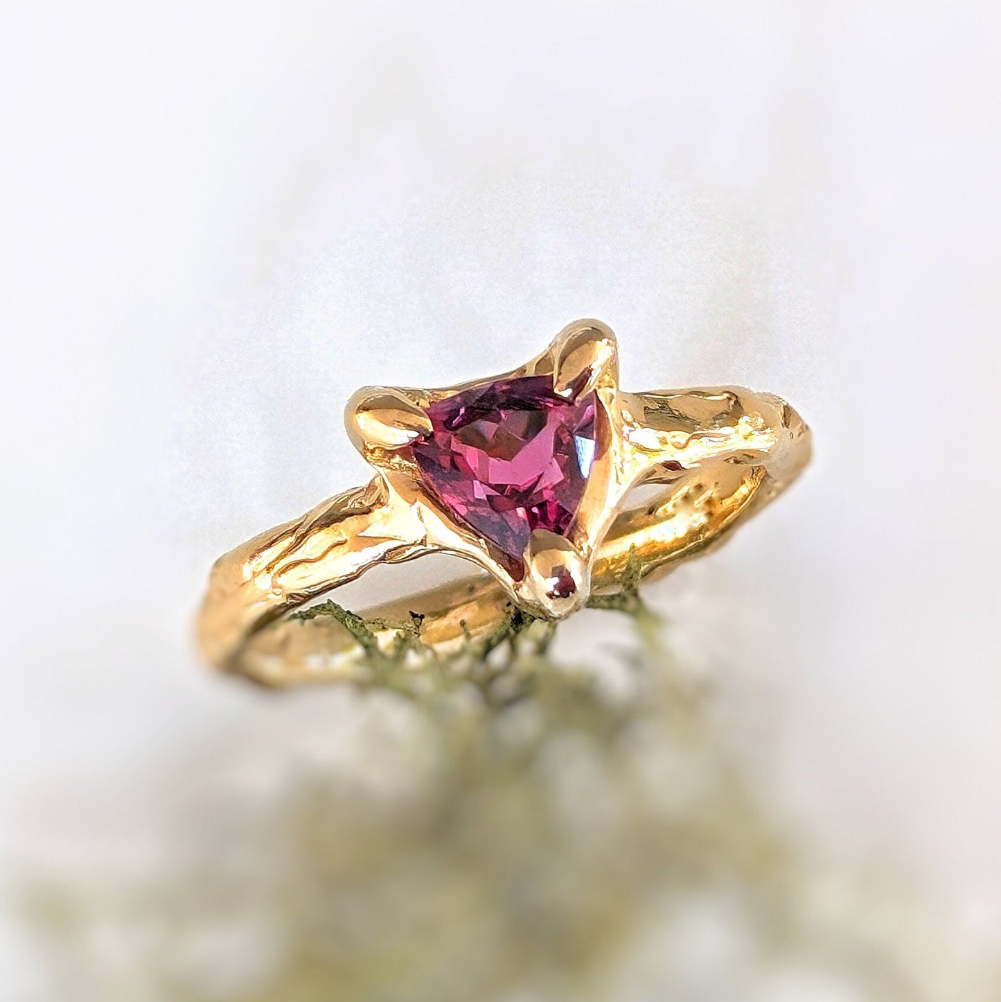 Solid 14k Gold engagement ring with Trilliant Rubellite Tourmaline, handcrafted with an organic textured band.
