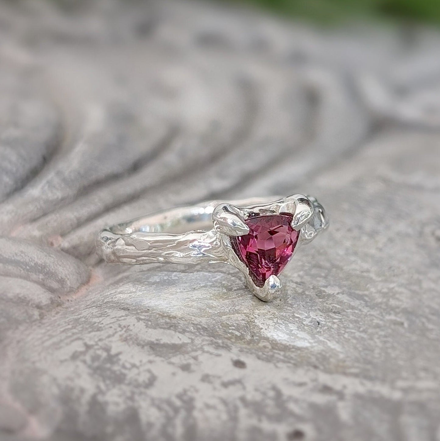 Dainty Rubellite Tourmaline engagement ring in Solid 14k Gold with a textured band, featuring a trilliant shape gem.