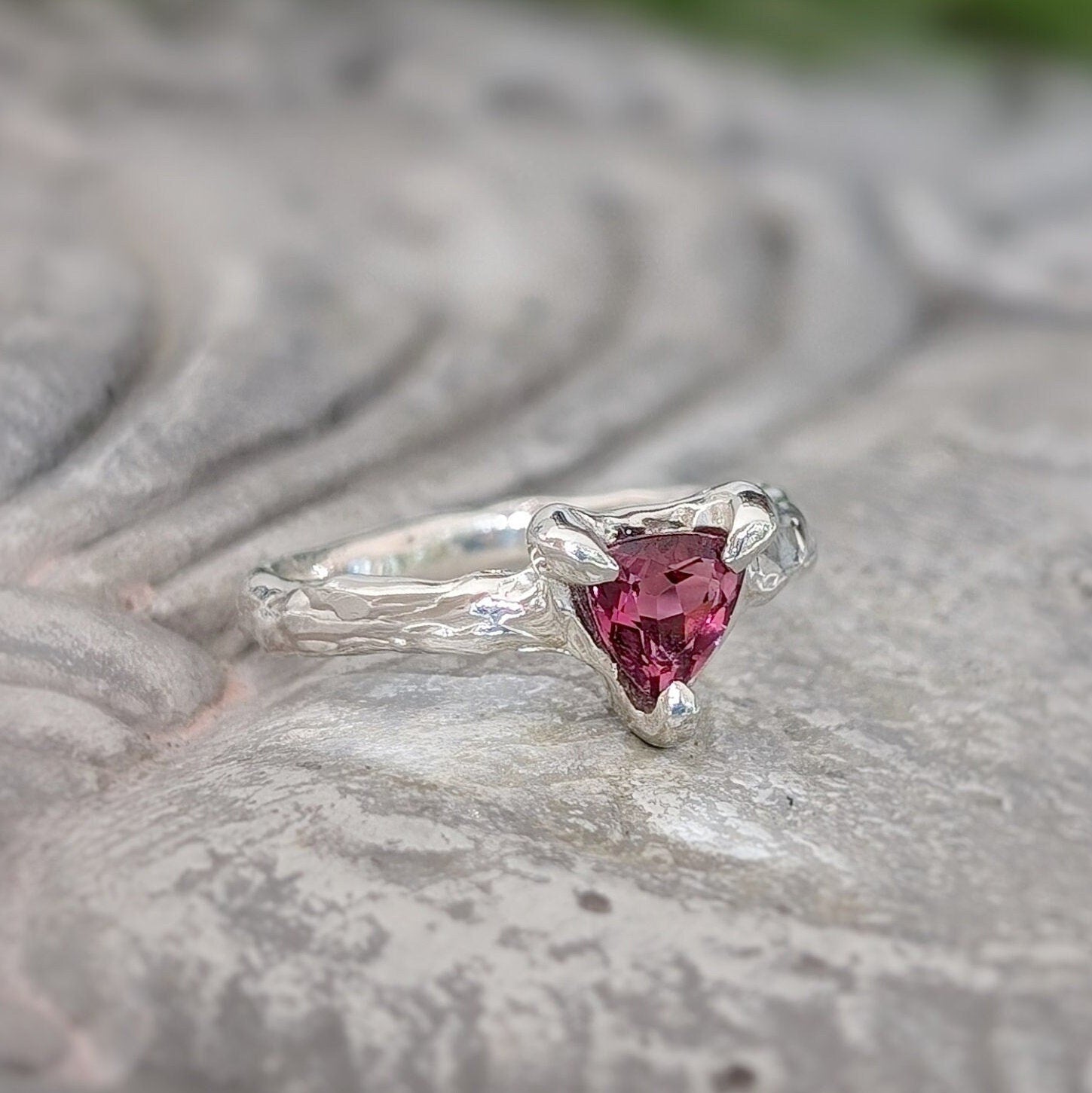 Dainty Rubellite Tourmaline engagement ring in Solid 14k Gold with a textured band, featuring a trilliant shape gem.