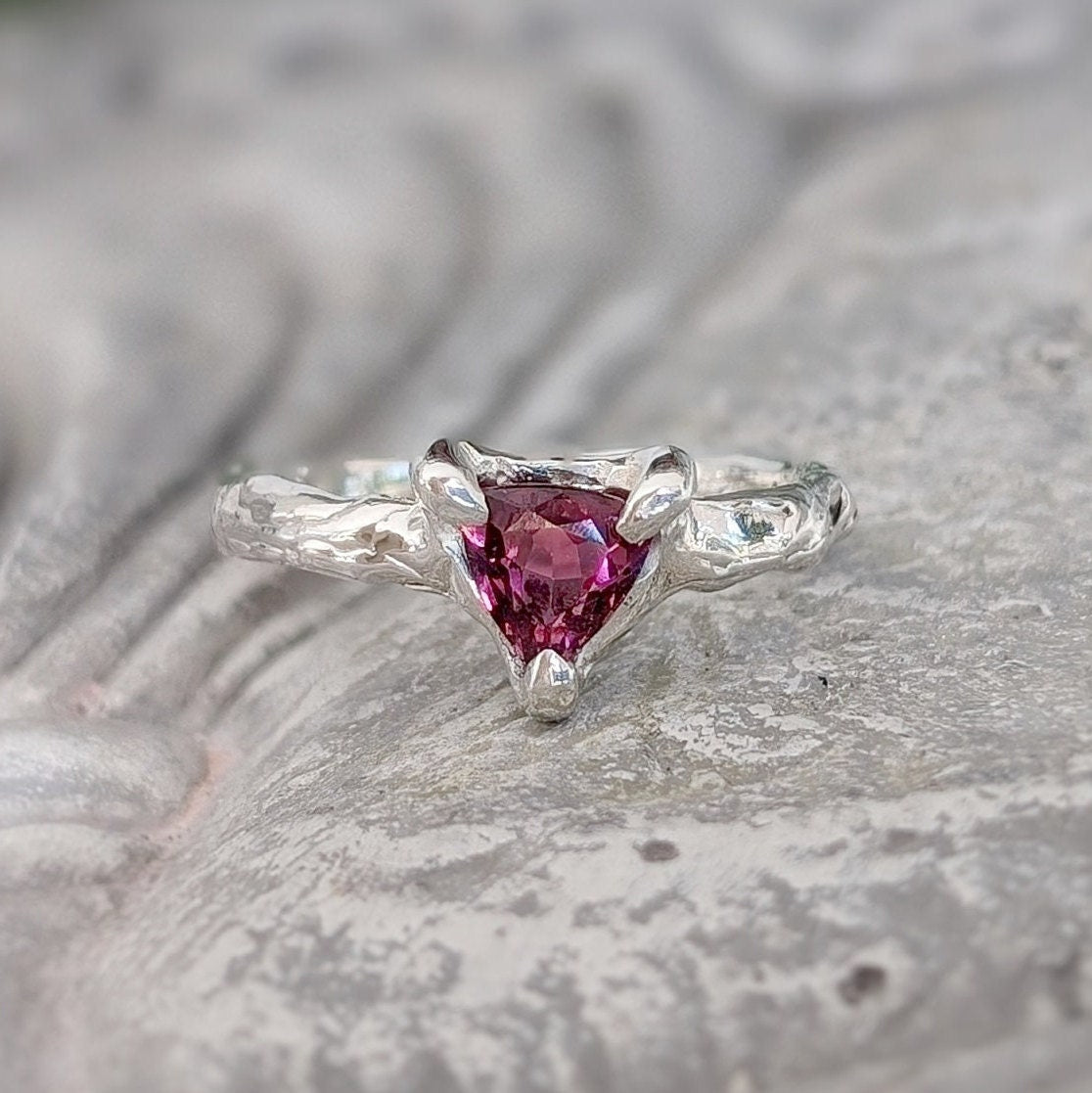 Rubellite Tourmaline engagement ring in solid 14k gold with organic textured band and trilliant shape gem.
