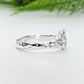 Handcrafted sterling silver cluster ring side view, showcasing organic molten design and sparkling cubic zirconia stones.