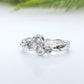 Sterling silver cubic zirconia cluster ring showcasing an organic molten band and sparkling stones.