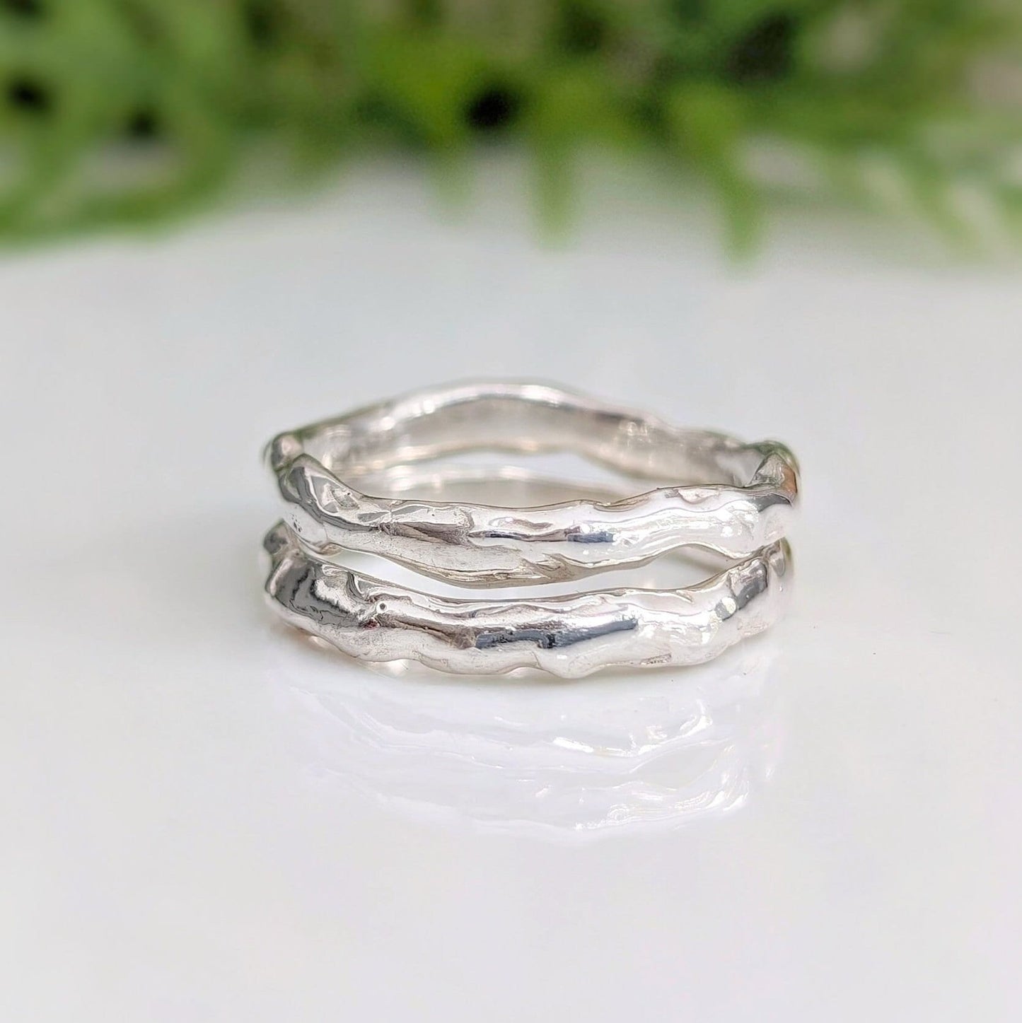 Handcrafted Molten Silver stacking rings showcasing an irregular, nature-inspired design in solid 3mm sterling silver.