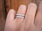 Handcrafted Molten Silver stacking rings on a finger, showcasing unique abstract design and individual beauty.