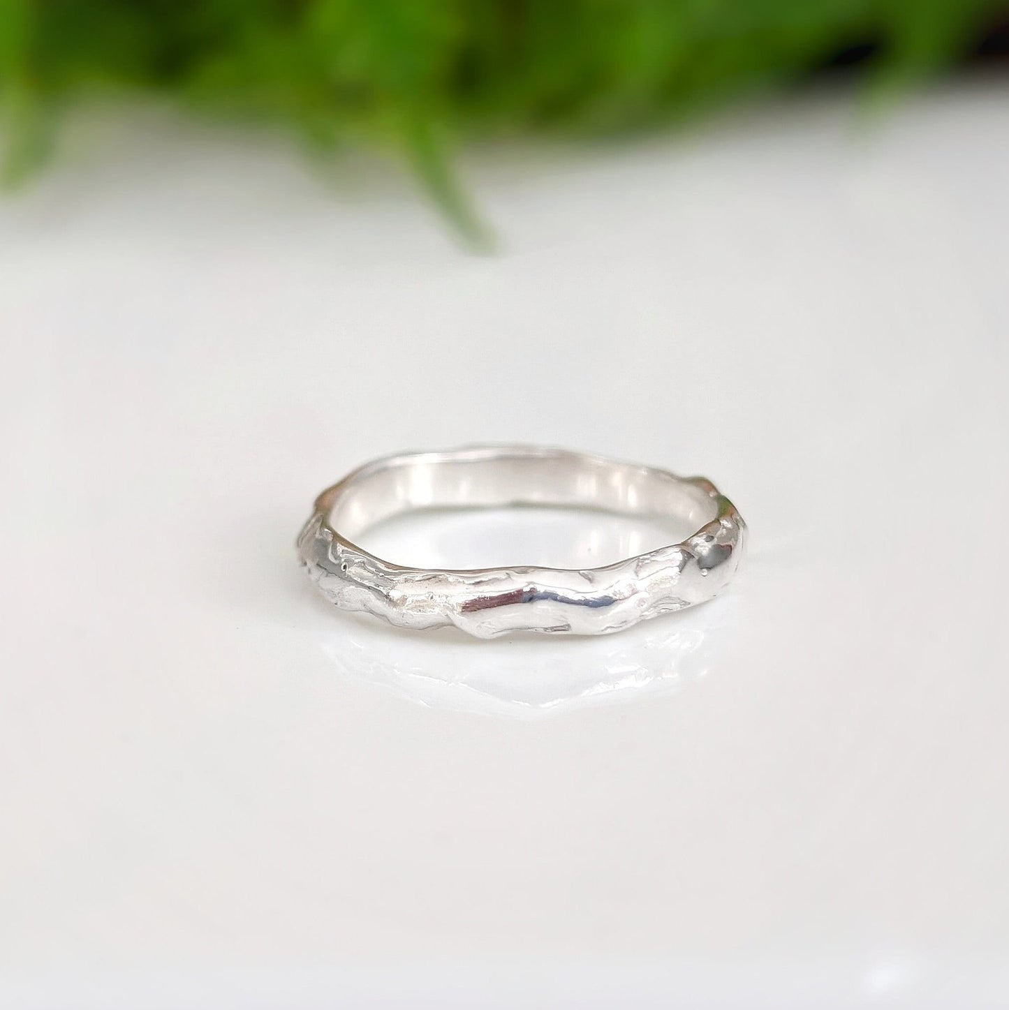 Handcrafted Molten Silver wedding band featuring a unique abstract design, perfect for stacking or as an individual statement ring.