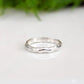 Handcrafted Molten Silver wedding band featuring a unique abstract design, perfect for stacking or as an individual statement ring.