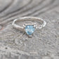 Handcrafted solid silver ring featuring a trilliant aquamarine gemstone, symbolizing love and individuality.