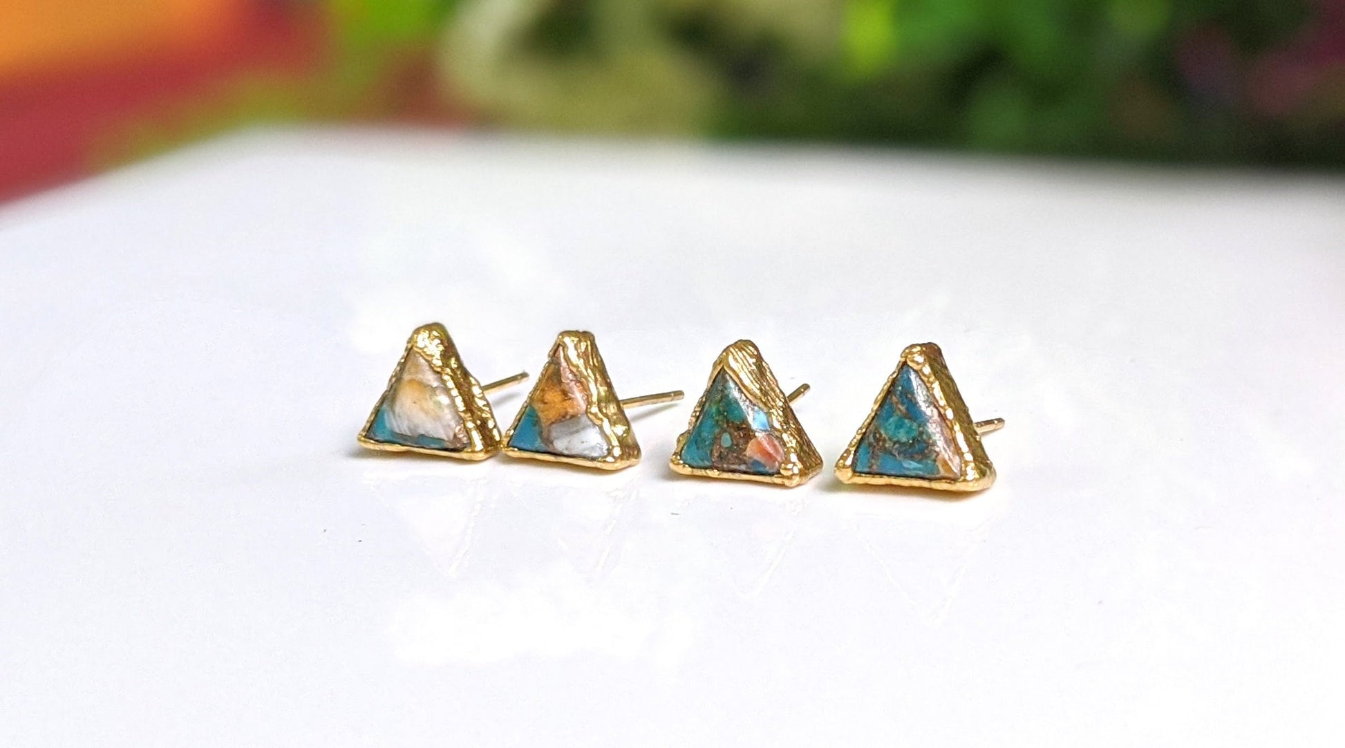 Spiny oyster copper turquoise stud earrings with triangular stones on gold-filled posts.