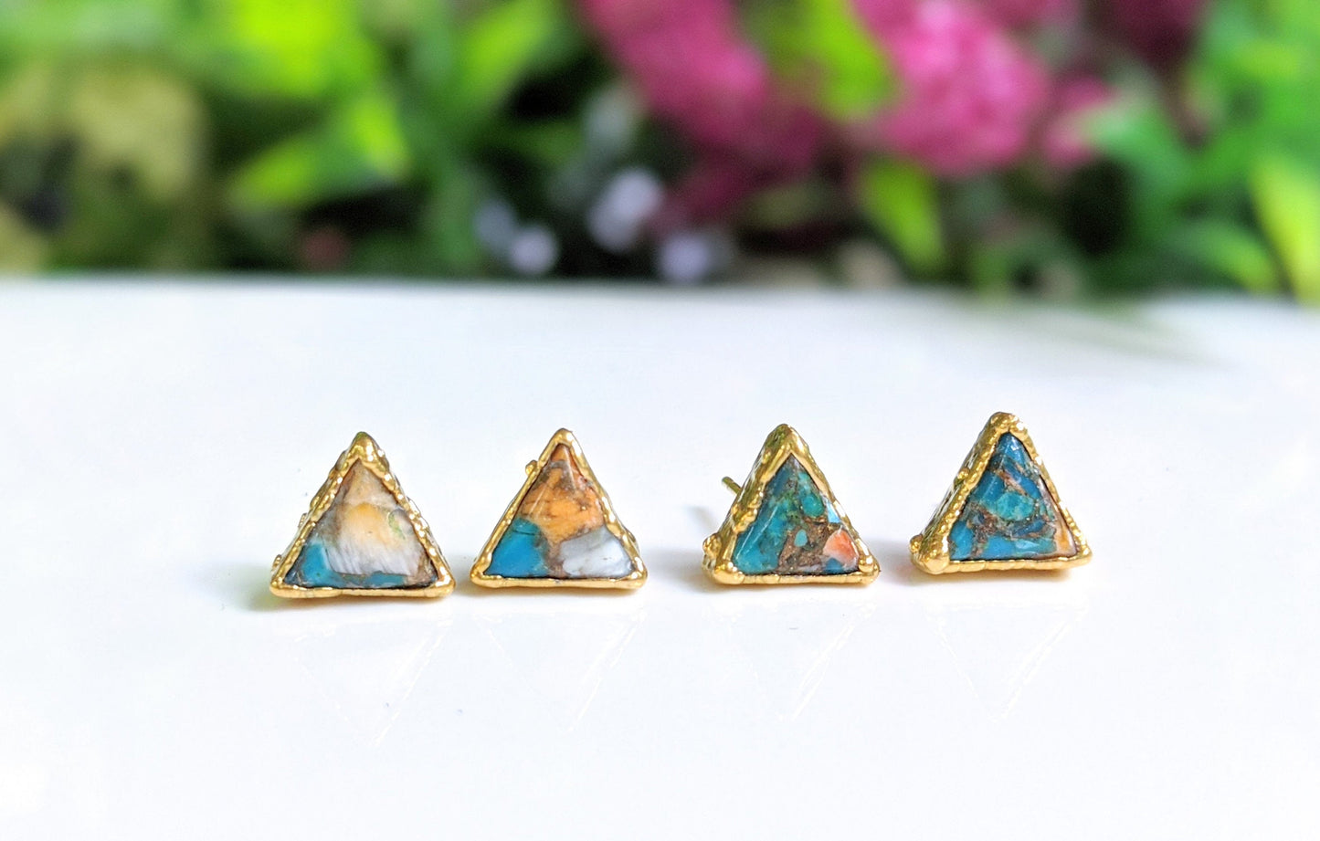 Spiny oyster copper turquoise stud earrings, triangular design on 14k gold filled posts, displaying beautiful stones.