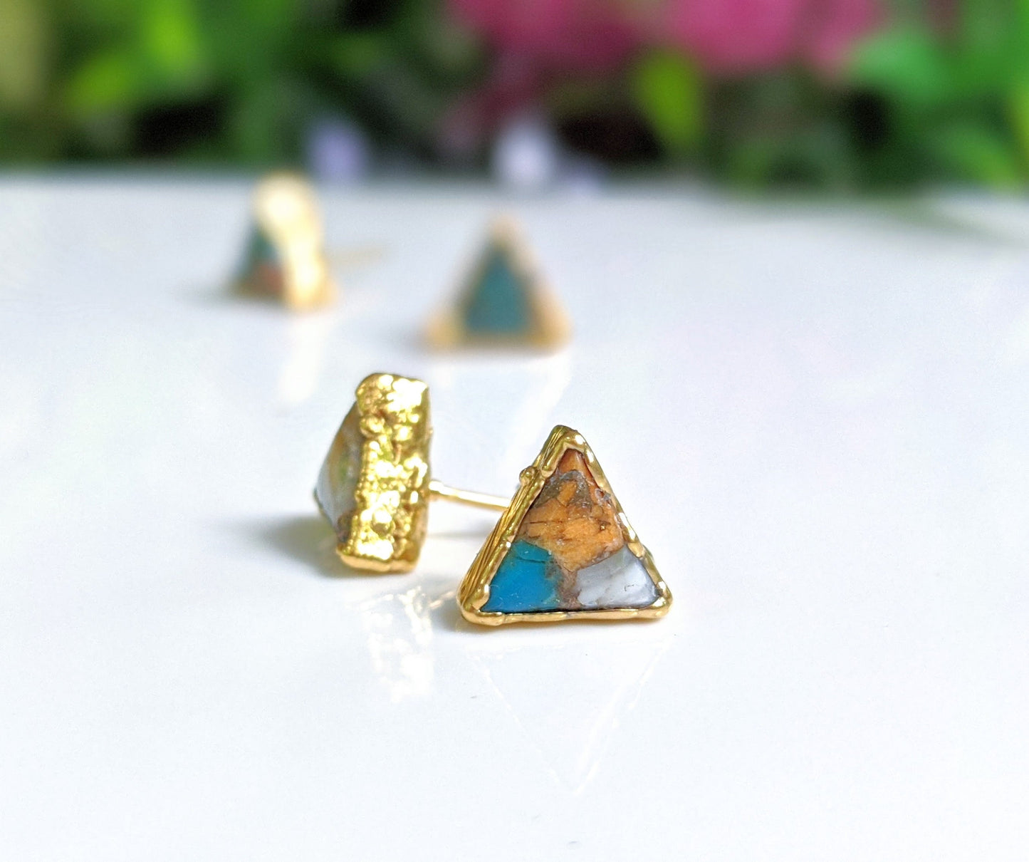 Triangular Spiny Oyster copper Turquoise stud earrings on gold posts, highlighting unique natural stones and elegant design.
