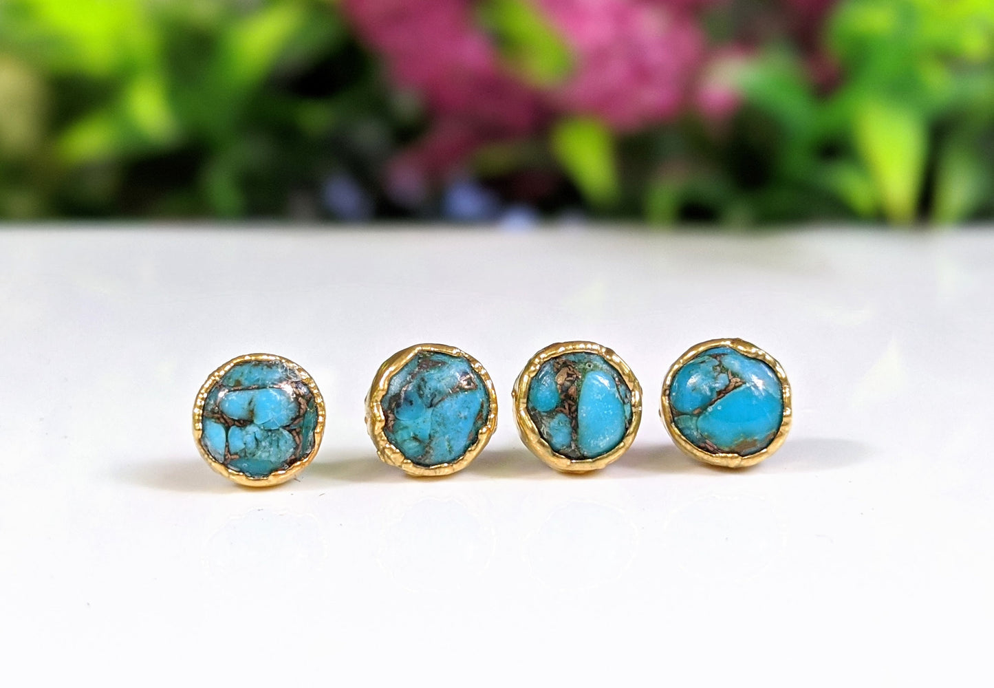 Turquoise stud earrings featuring 10mm round copper turquoise stones set on gold filled posts.