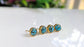 Stylish turquoise stud earrings featuring round copper stones set in gold-filled posts.