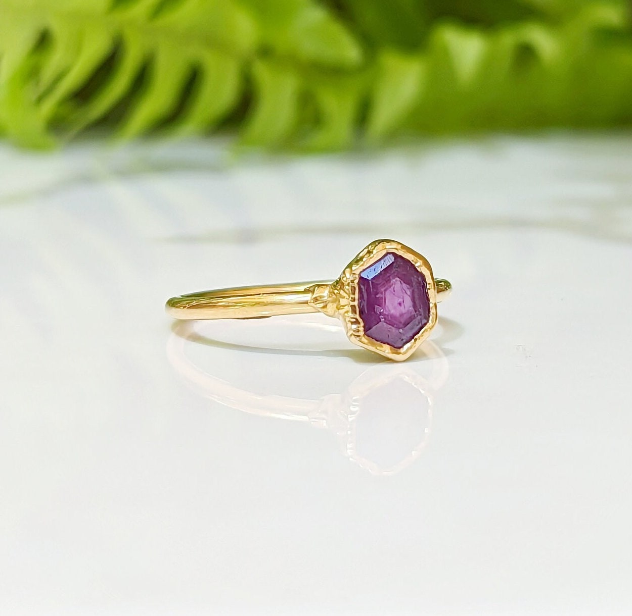 Handcrafted hexagonal Pink Star Sapphire ring in 14k Gold, showcasing elegance and unique beauty.
